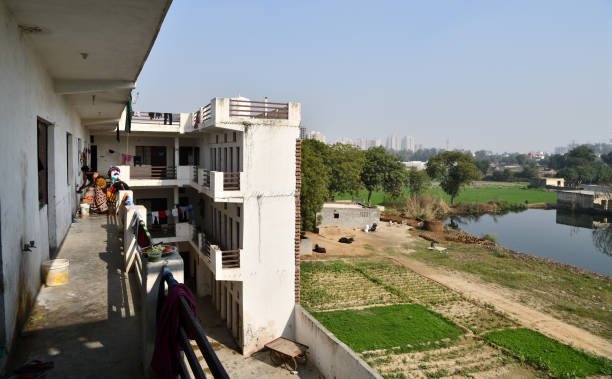 DELHI, INDIA - JANUARY 7 : Old village on the construction site in Noida, short for the New Okhla Industrial Development Authority. It is an extension of Delhi, the capital of India on January 7, 2018 in Delhi, India. (Photo by Frédéric Soltan/Corbis via Getty Images)